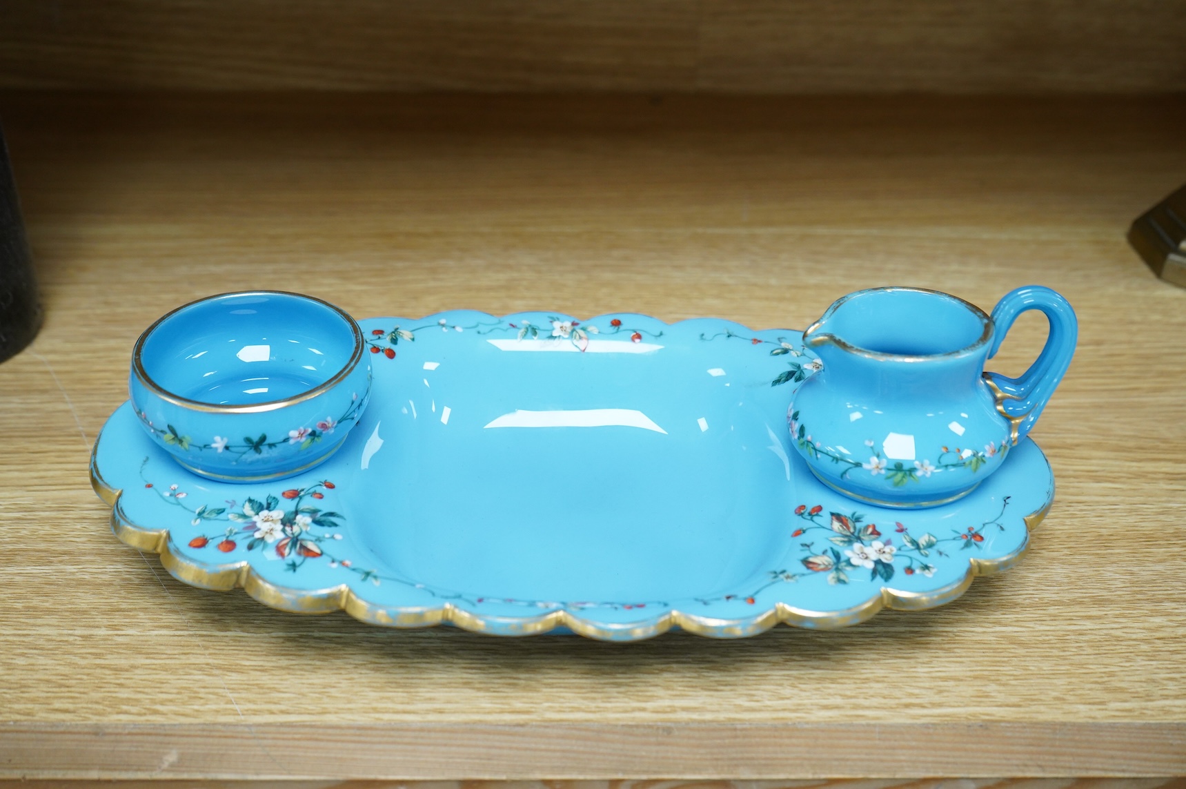 A 19th century opaline strawberry set, 30cm wide